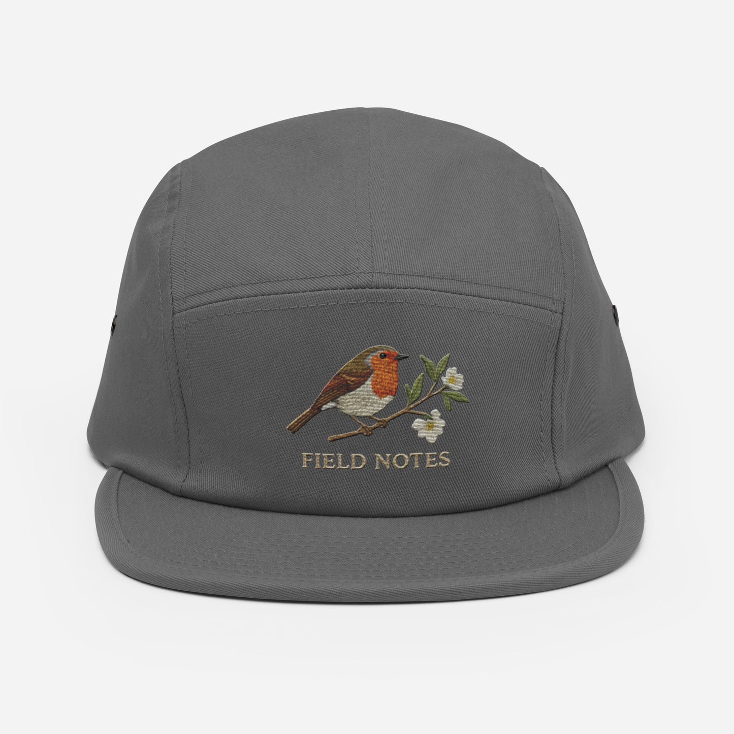 Olive green 5-panel camp hat with embroidered robin bird and Trini Skies design