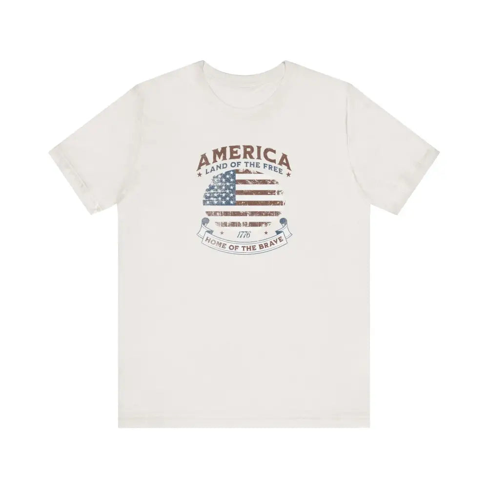White short-sleeved vintage t-shirt with American flag graphic and Trini Skies design