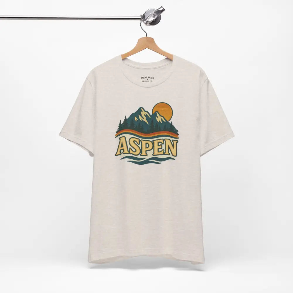Cream-colored Aspen Lodge Tee with colorful mountain drawn design features by Trini Skies Supply