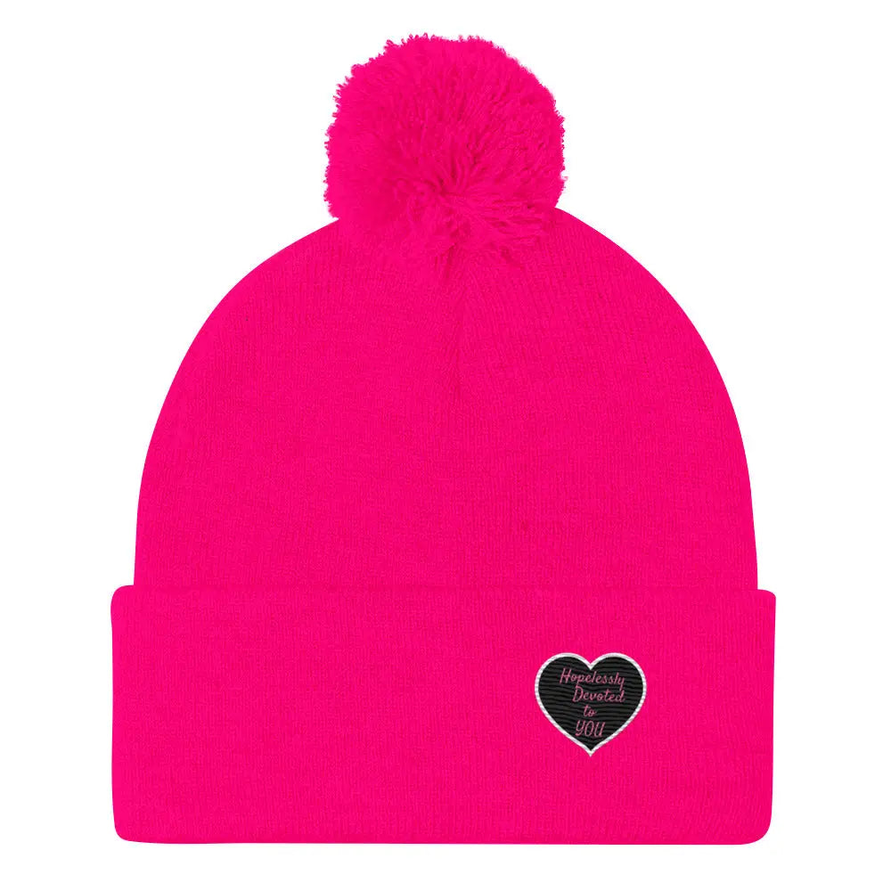 Vibrantly pink Hopelessly Devoted embroidered Valentine heart pom-pom beanie