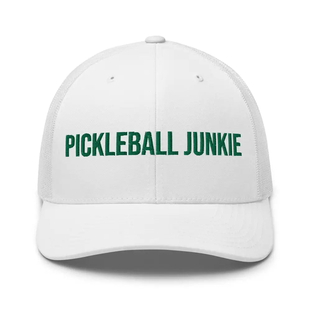 White trucker hat with green embroidered pickleball junkie embroidered Trini Skies logo