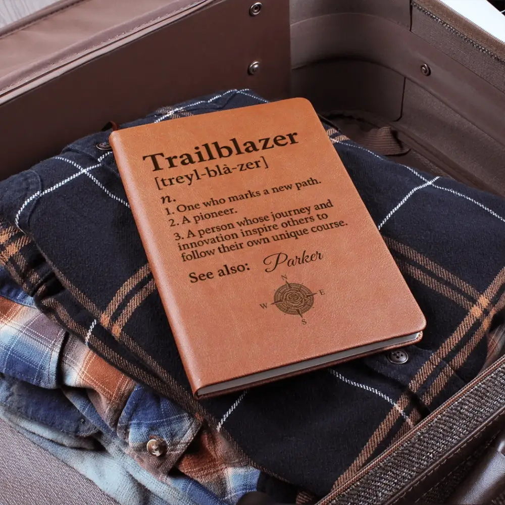 Personalized brown leather Trailblazer journal with compass design and definition, perfect for adventure lovers