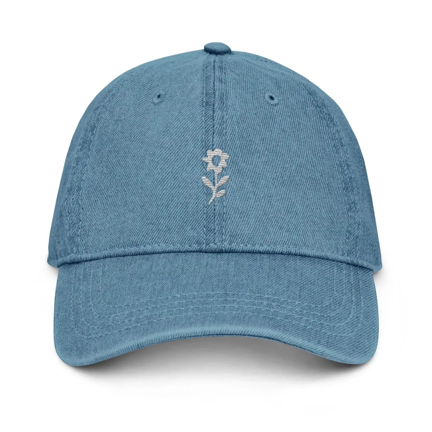 Minimalist embroidered delicate flower, denim blue accents, white background
