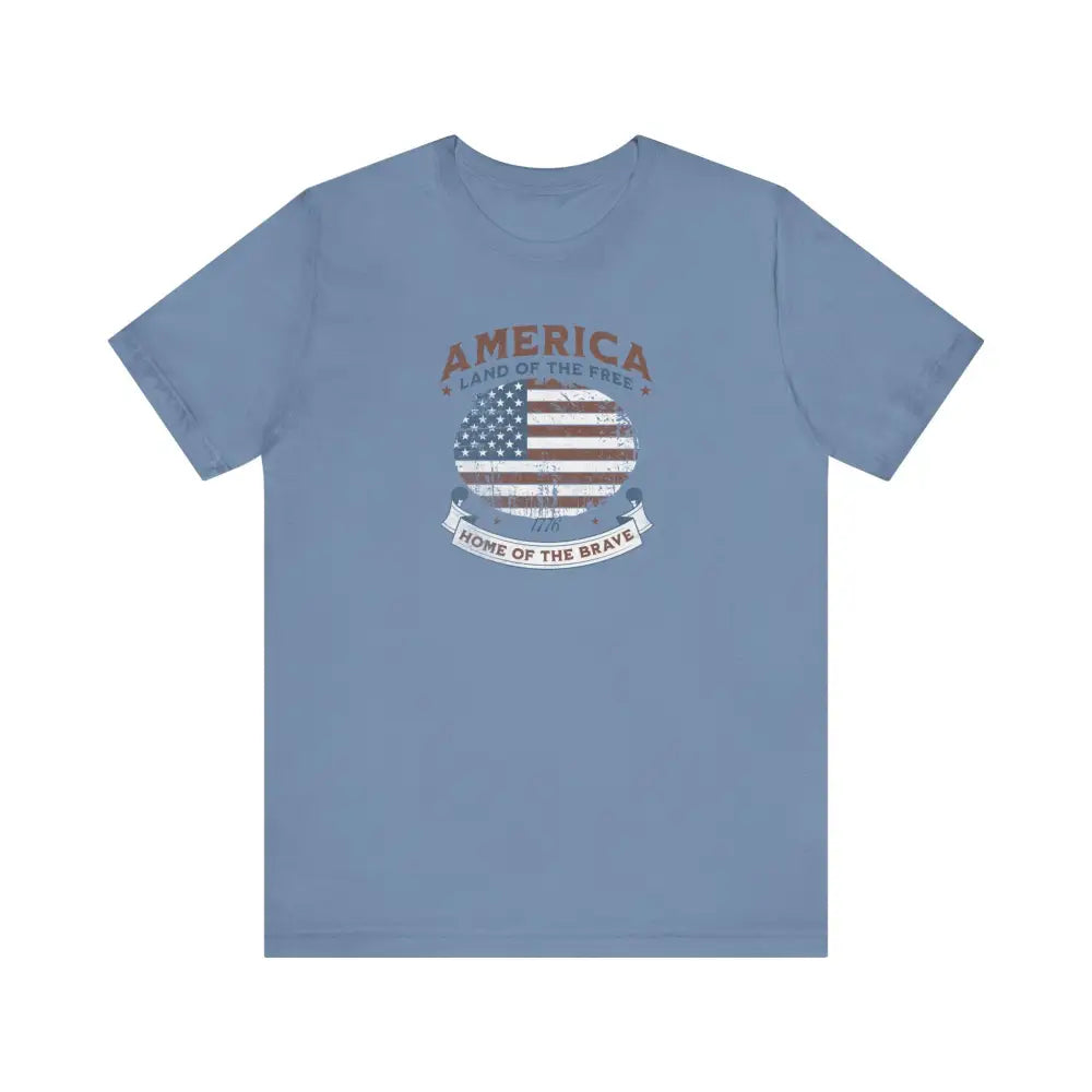Light blue vintage t-shirt with distressed American flag graphic by Trini Skies