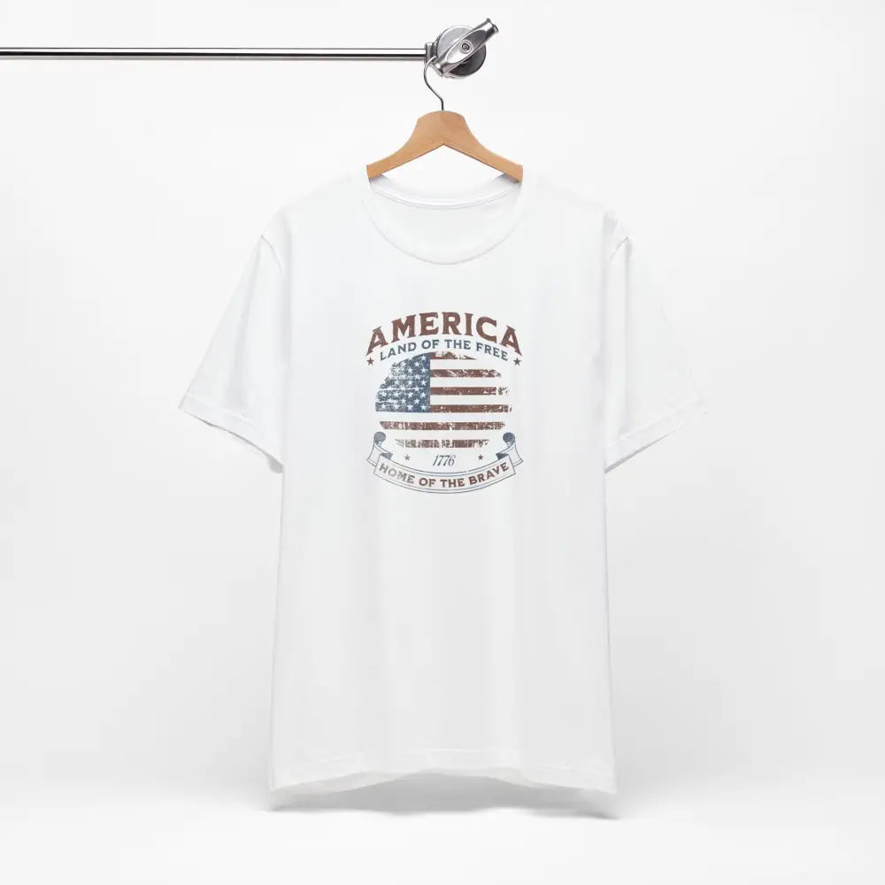 White short-sleeve vintage t-shirt with American flag graphic and Trini Skies design