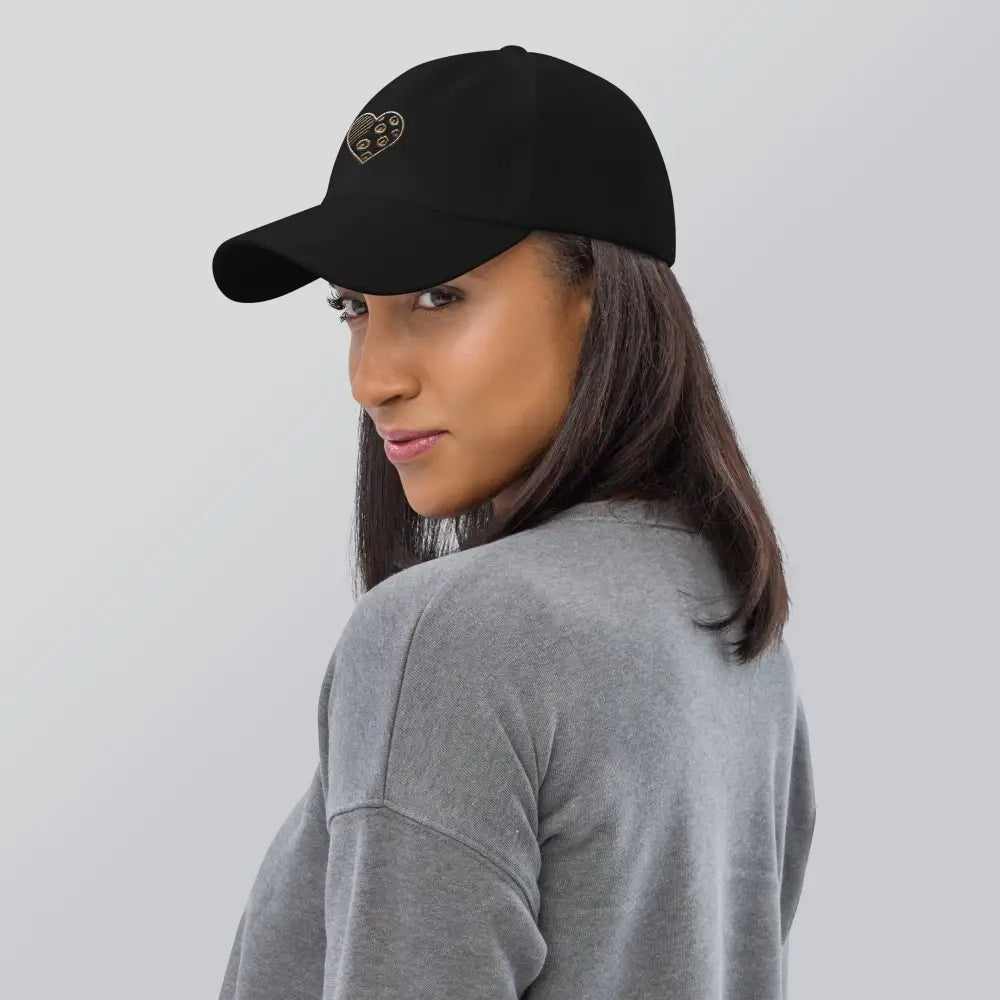 Animal print embroidered heart dad hat on woman in black cap