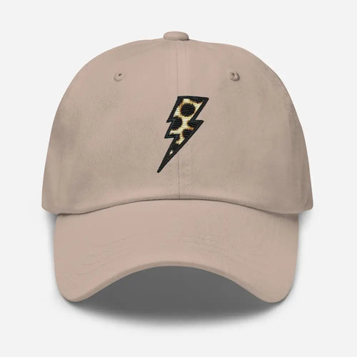 Tan baseball cap with animal print embroidered lightning bolt