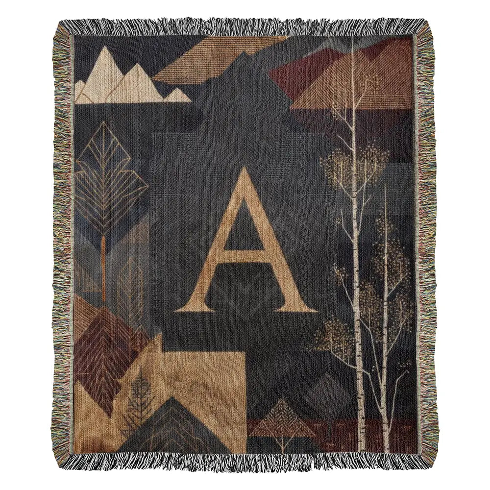 Aspen initial woven blanket with gold A and alpine motifs