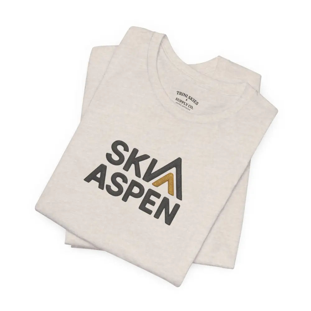 Folded cream Aspen Mountain Tee in Bella+Canvas Premium vintage ski design