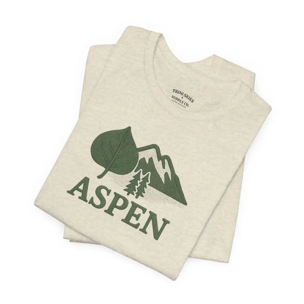 Folded cream Aspen Mountain Tee with green Aspen design, perfect for outdoor adventure