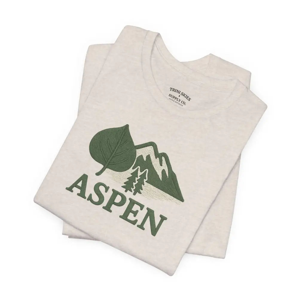 Cream-colored Aspen Mountain Tee with green Aspen design, perfect outdoor adventure style