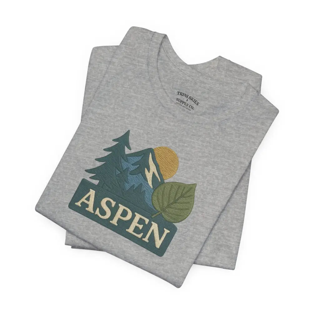 Folded gray Bella Canvas Aspen Mountain Tee with detailed DTG graphic and embroidered corduroy