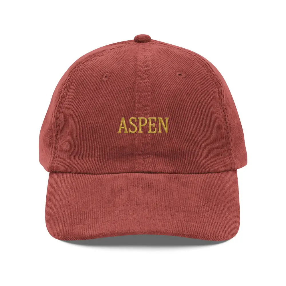 Red embroidered corduroy hat with Aspen embroidered in gold, inspired by Trini Skies and snow-capped peaks stitched