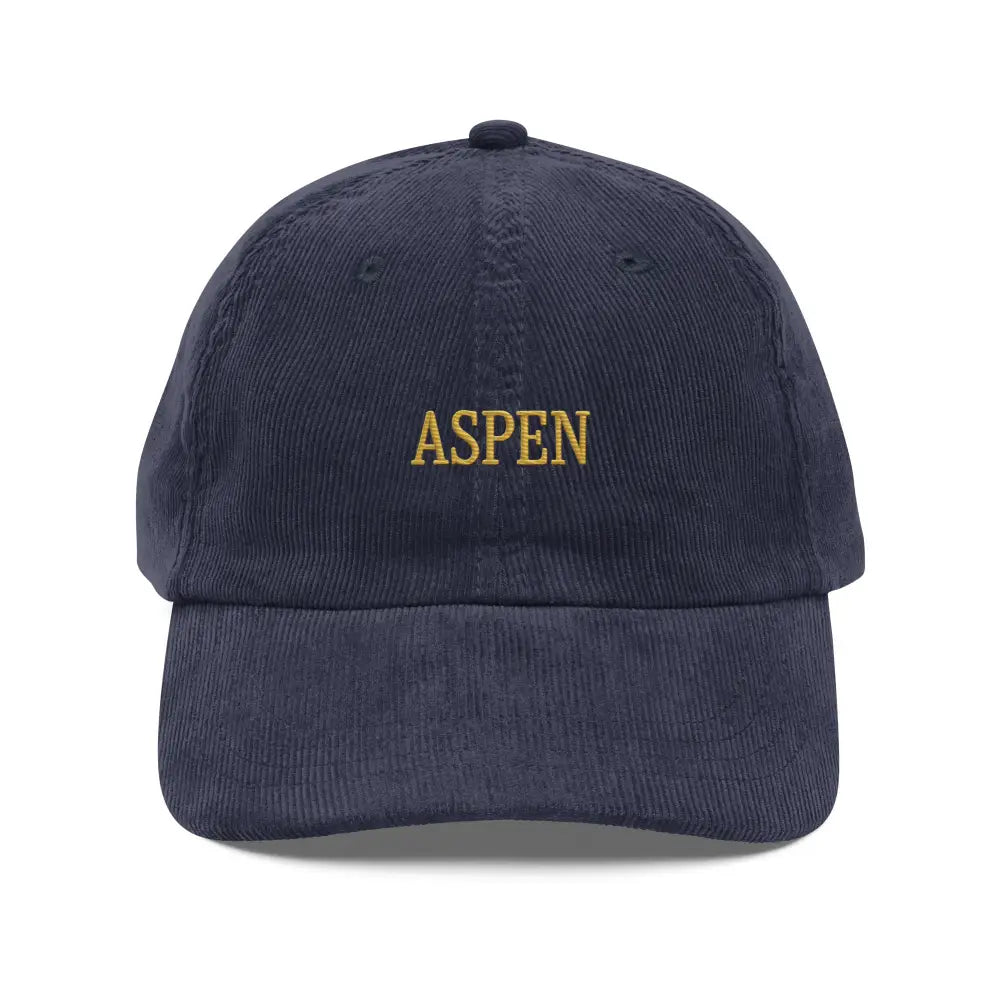 Dark blue embroidered corduroy hat with Aspen snow-capped peaks stitched and Trini Skies branding