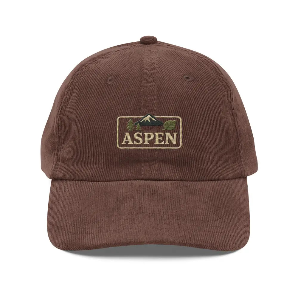 Brown corduroy embroidered hat with snow-capped peaks stitched mountain and tree design