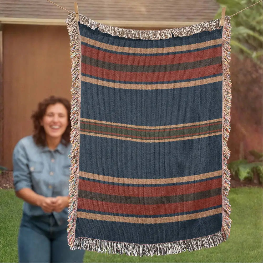 Aspen stripe woven blanket in navy, rust, and beige stripes with fringes