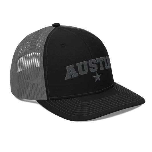 Black and gray mesh trucker hat with Austin Texas embroidered star design