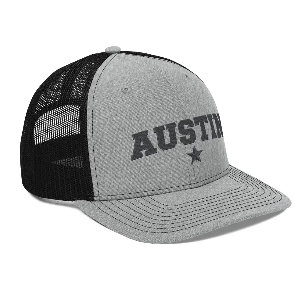 Gray and black mesh-back trucker hat with Austin Texas embroidered star design