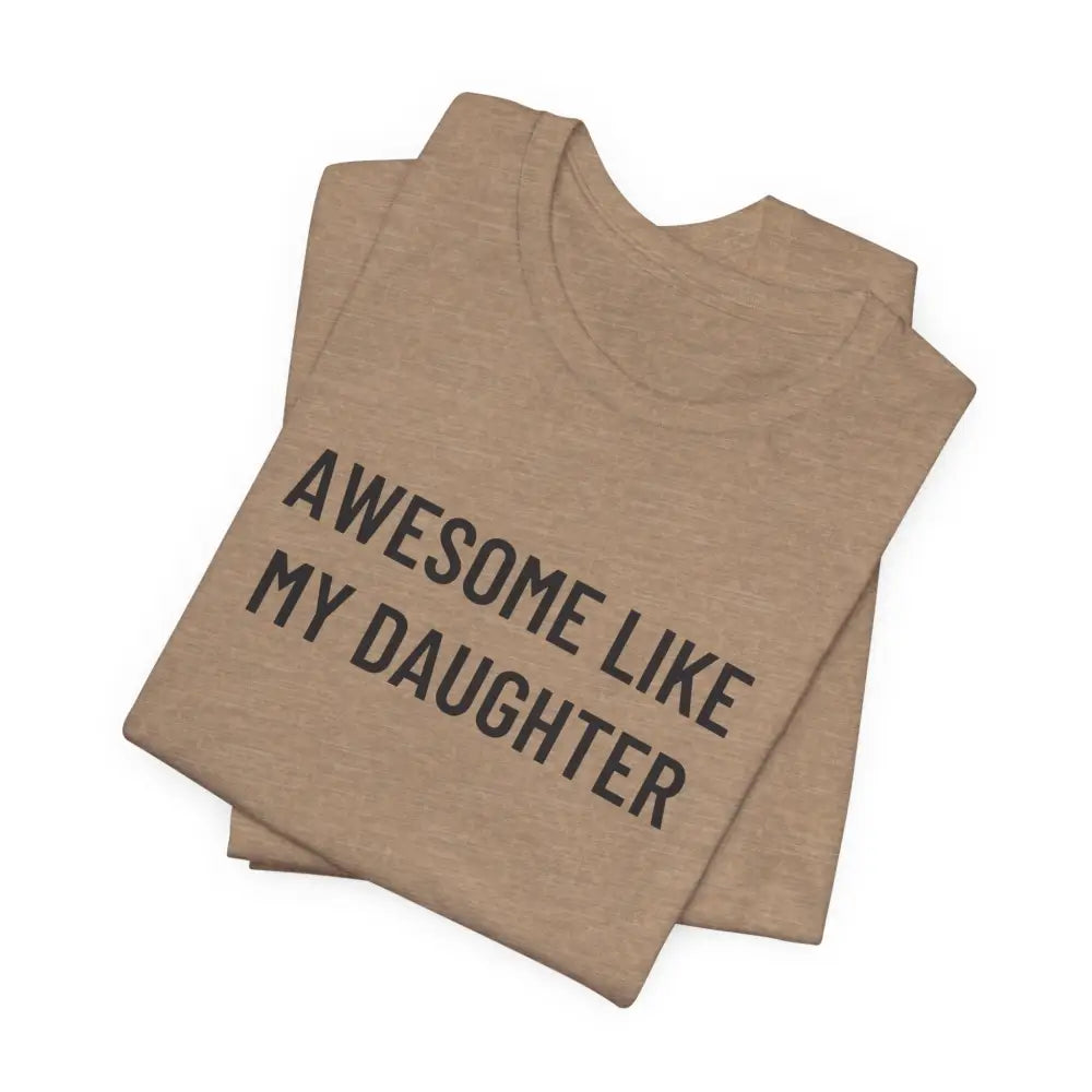 Folded tan t-shirt with daughter funny graphic to celebrate fatherhood