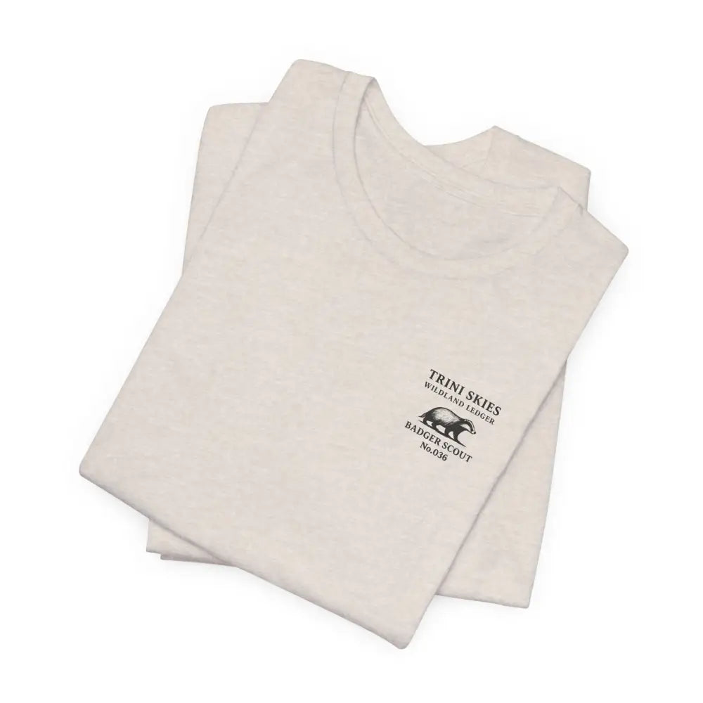 Folded cream badger scout t-shirt with heritage-inspired design featuring wildlife graphic