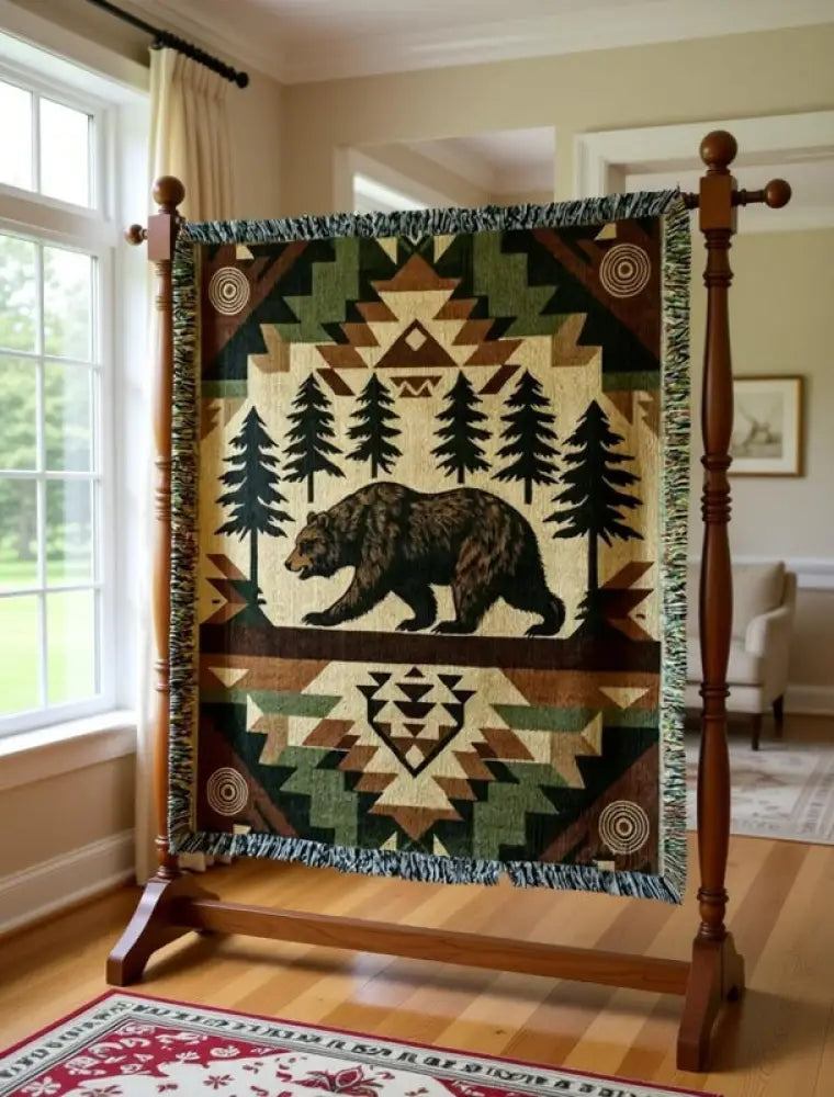 Rustic woodland tapestry throw with central brown bear among pines