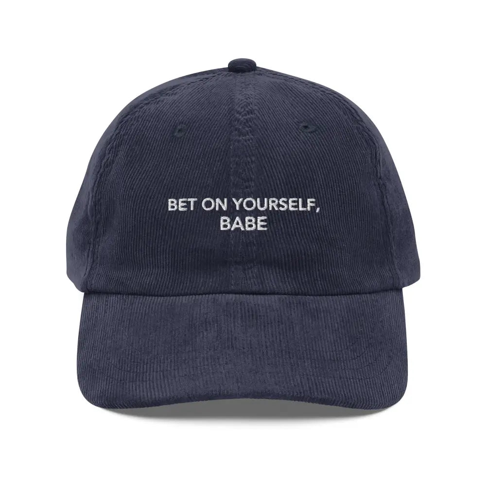 Trini Skies embroidered corduroy cap in dark blue with white text