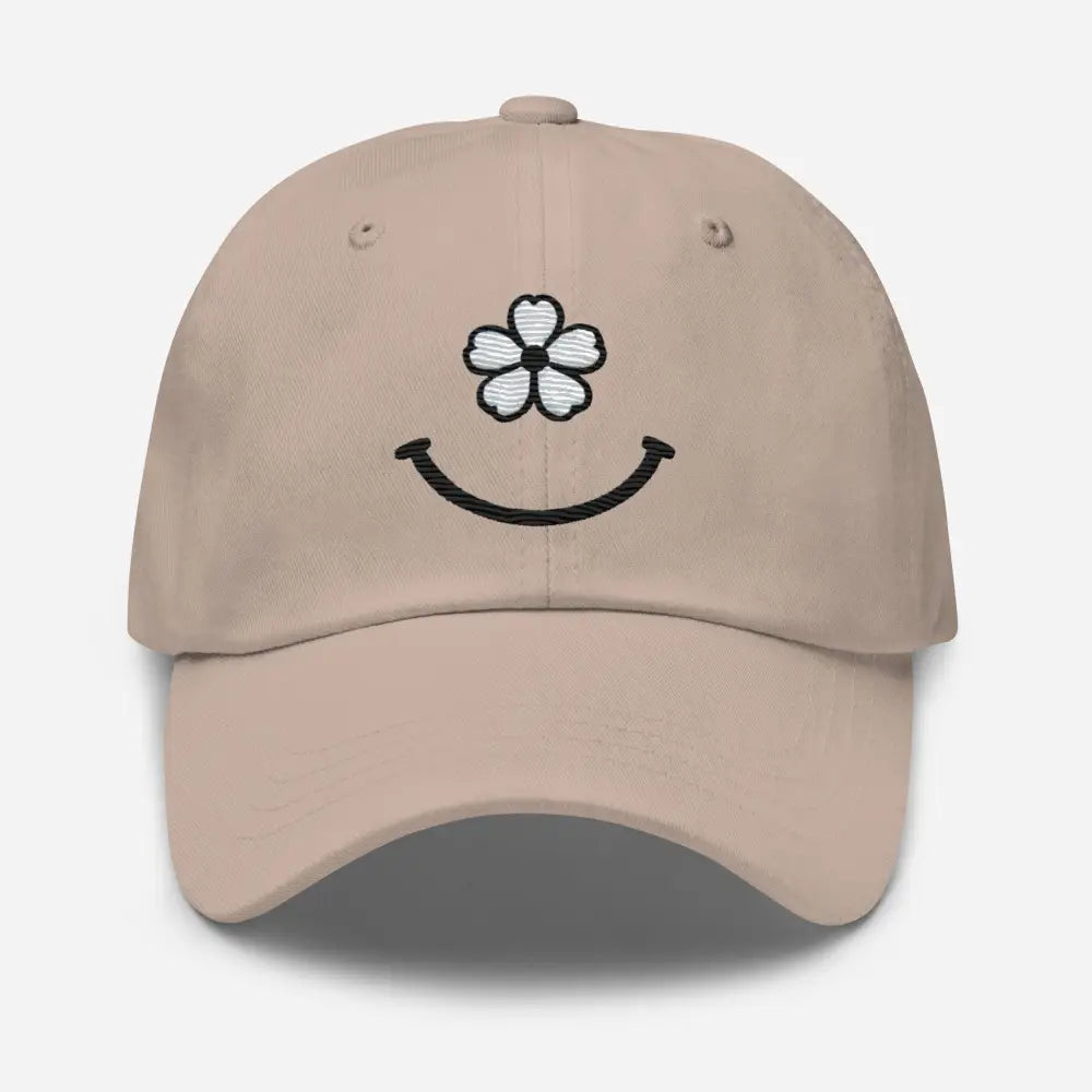 Light brown floral smiley face face dad hat with embroidered white flower and black smiley