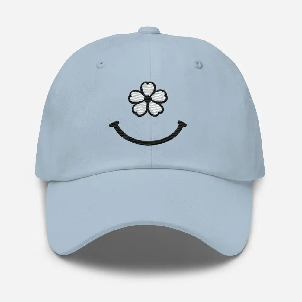 Light blue Floral Smiley Face Face Dad Hat with embroidered white flower and black smile