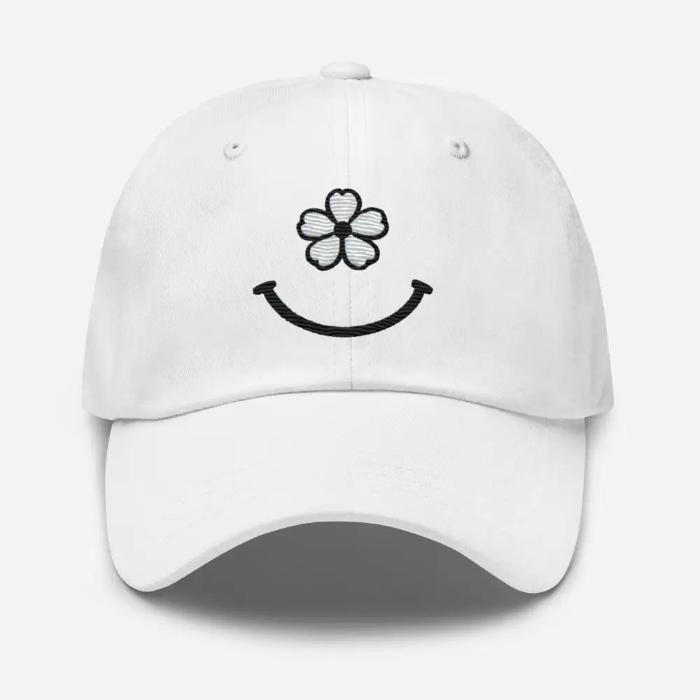 White floral smiley face dad hat with black embroidery spreading smiles