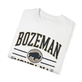 Folded white Trini Skies Bozeman Montana graphic tee with bison silhouette