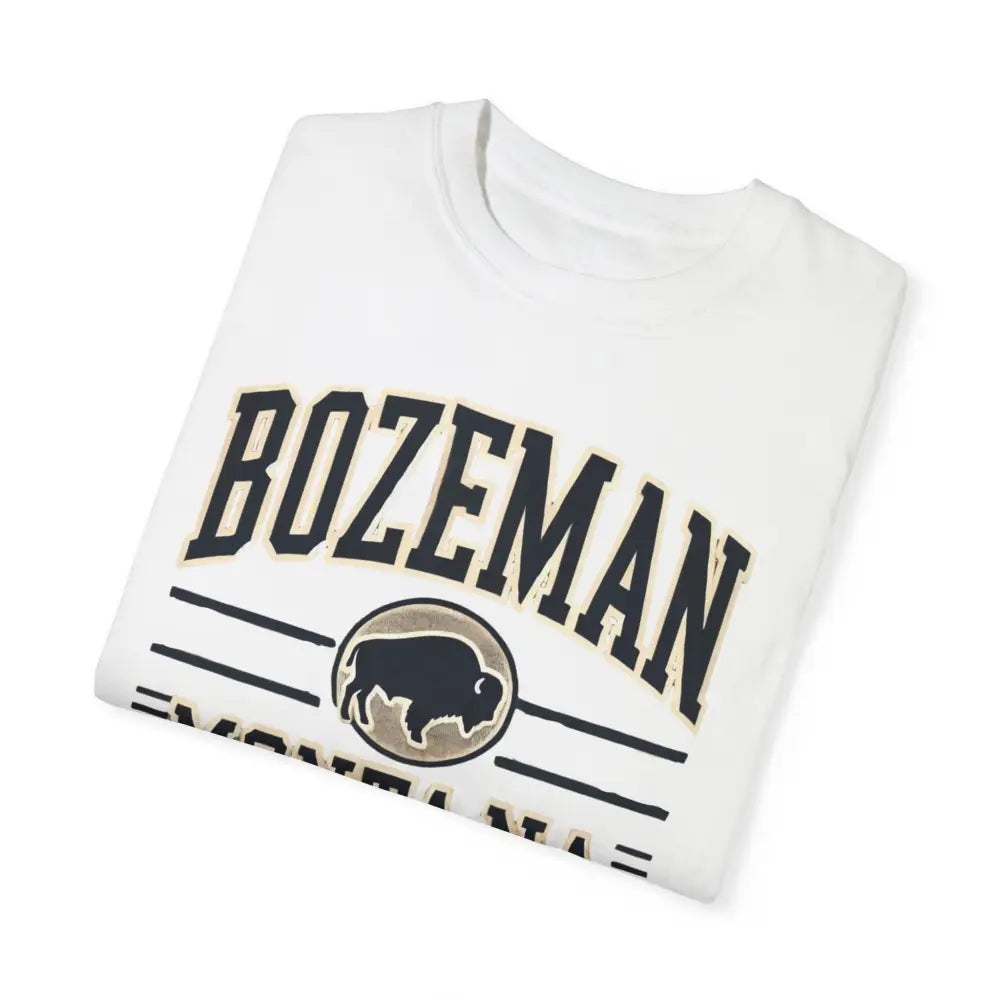Folded white Trini Skies Bozeman Montana graphic tee with bison silhouette