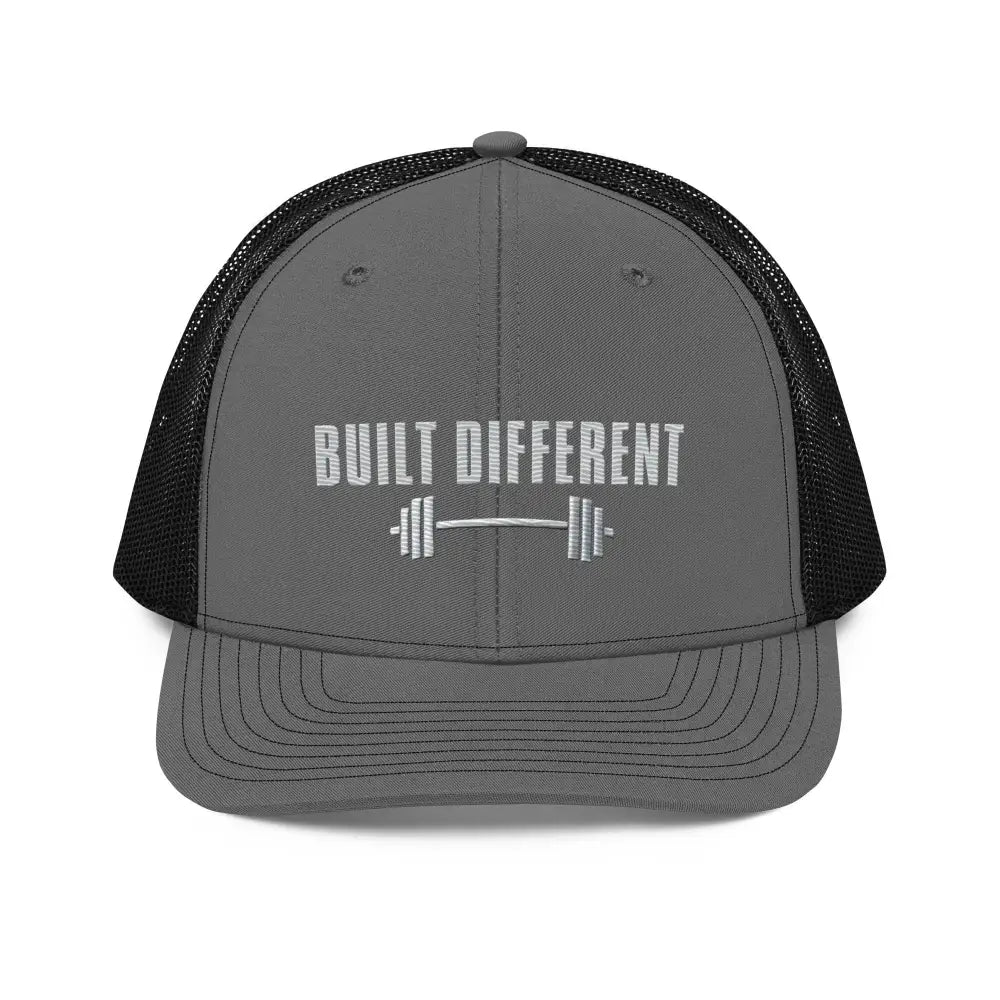 Built Different gray trucker hat by Trini Skies with barbell embroidery