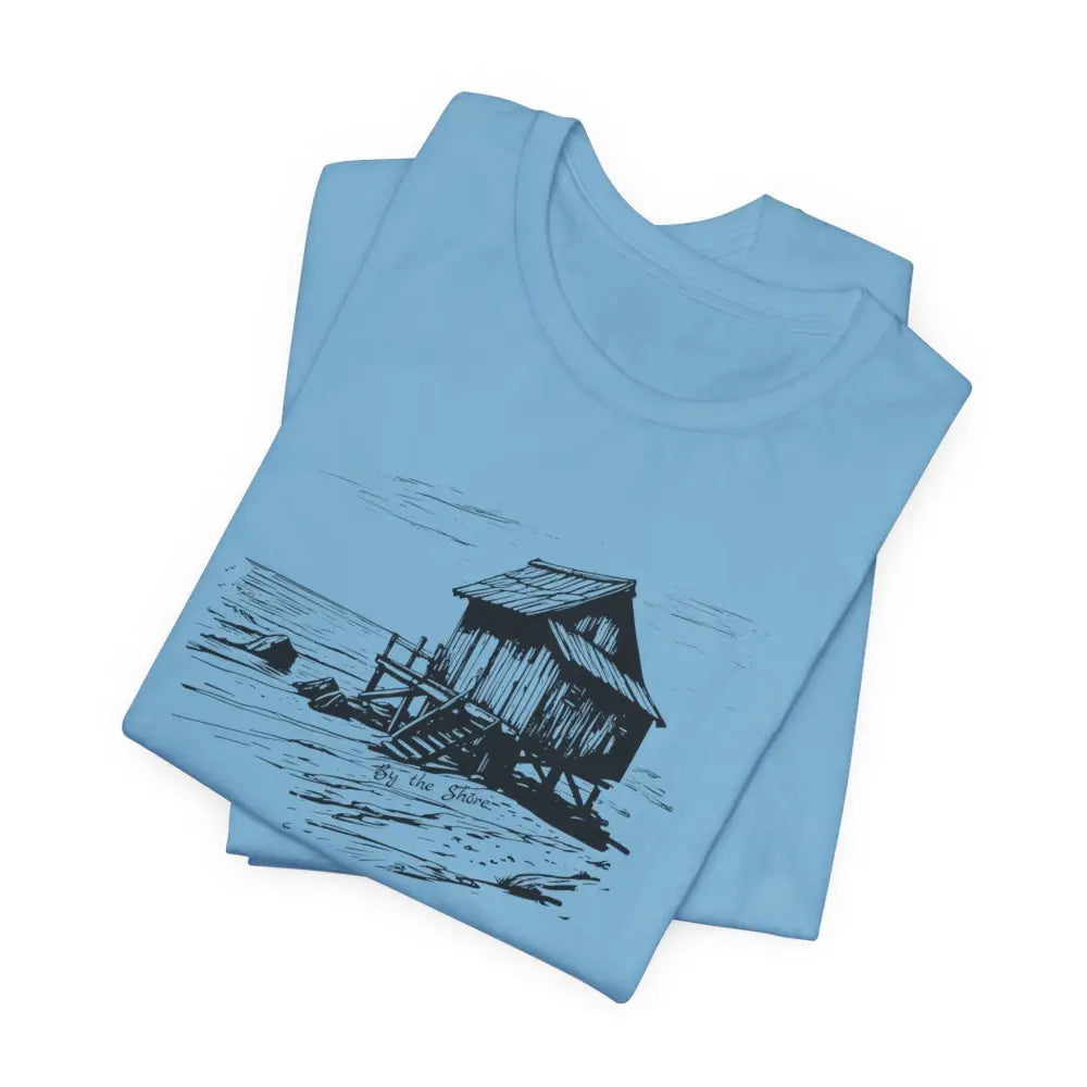 Trini Skies shore cabin tee with light blue crew-neck and black shore shack drawing