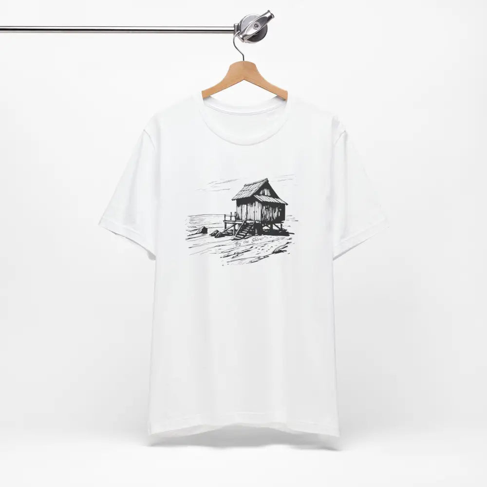Trini Skies shore cabin tee with rustic stilt house graphic