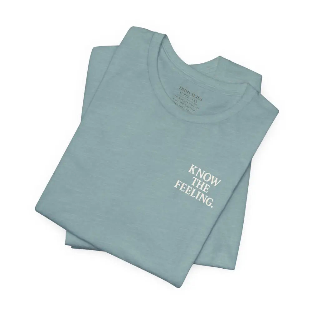 Folded light blue short-sleeve nautical compass tee by Trini Skies Supply