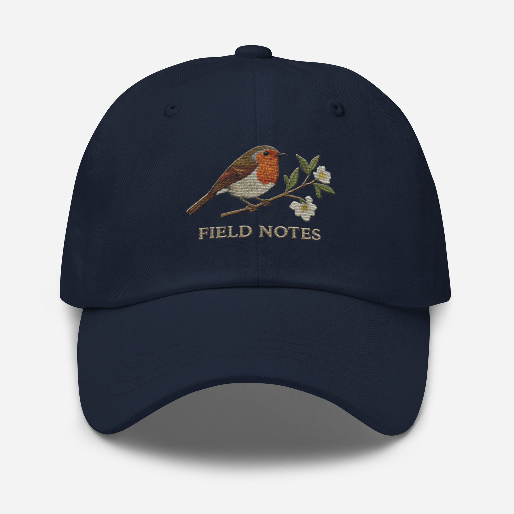Navy blue dad hat with embroidered robin bird, flowers, and Field Notes on vintage cotton twill