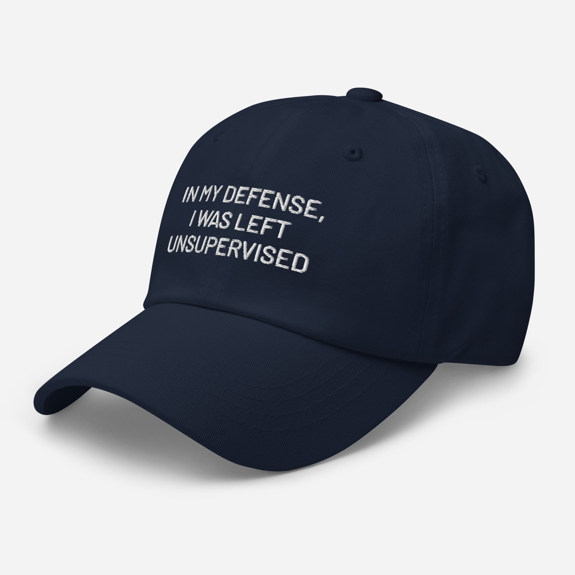 Navy blue embroidered dad hat with funny white text in my defense i was left unsupervised