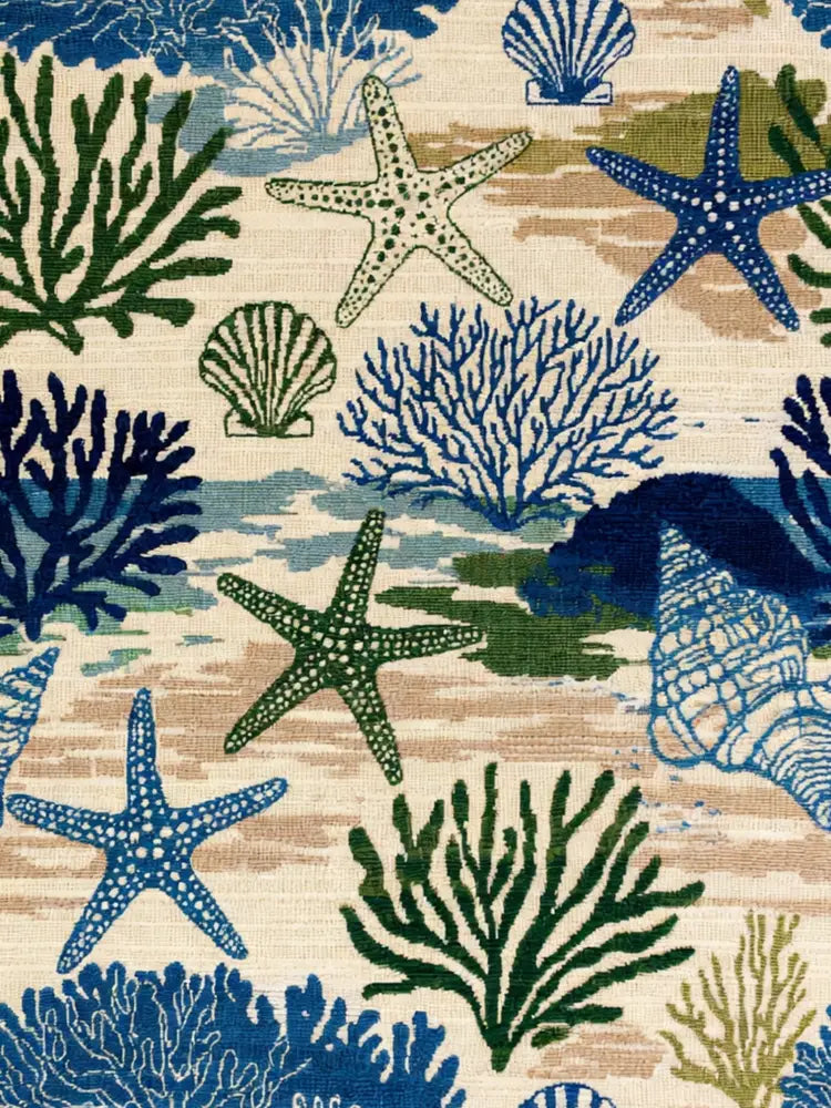Coastal woven blanket with starfish and coral pattern textile throw