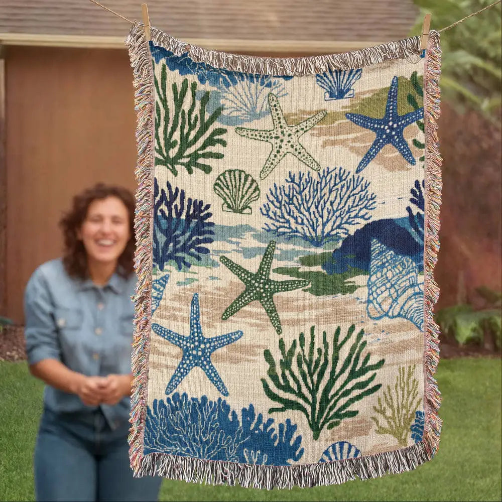 Coastal woven blanket with starfish coral pattern and fringe