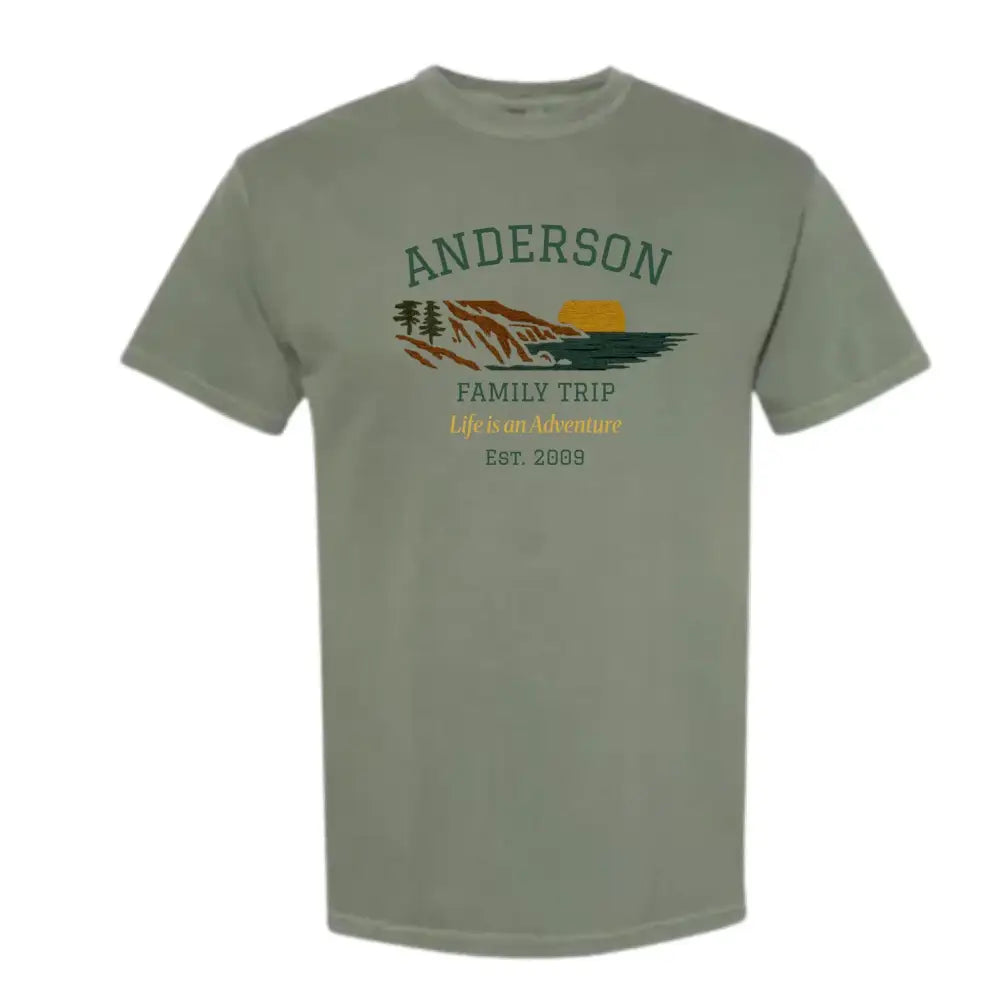 Green short-sleeved custom mountain sunset t-shirt with scenic graphic for outdoor adventures
