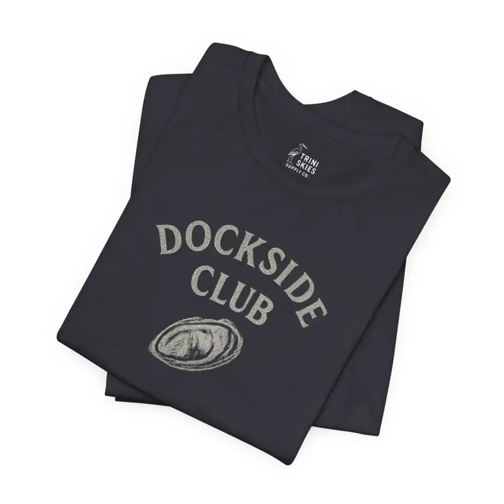Folded black Dockside Club tee with shell design by Trini Skies Supply
