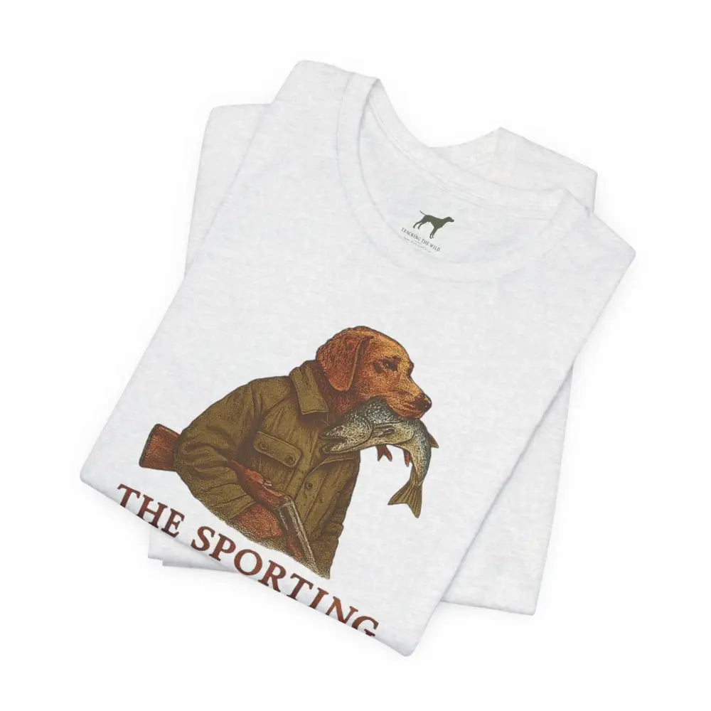 Folded white short-sleeve tee with dog fishing graphic from Trini Skies Supply