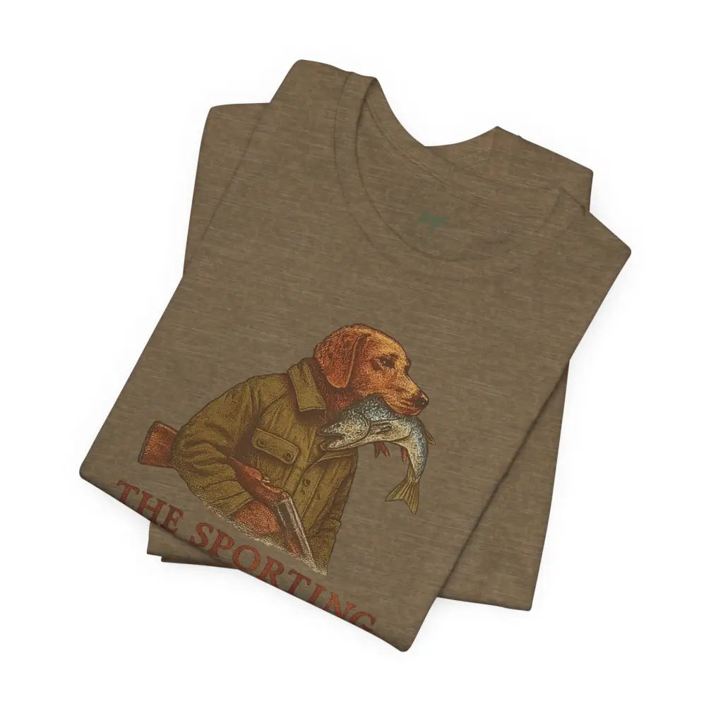 Folded brown Trini Skies tee with dog fishing graphic, celebrate timeless outdoor heritage