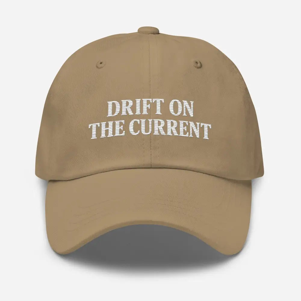 Tan baseball cap with white embroidered text from Trini Skies Supply