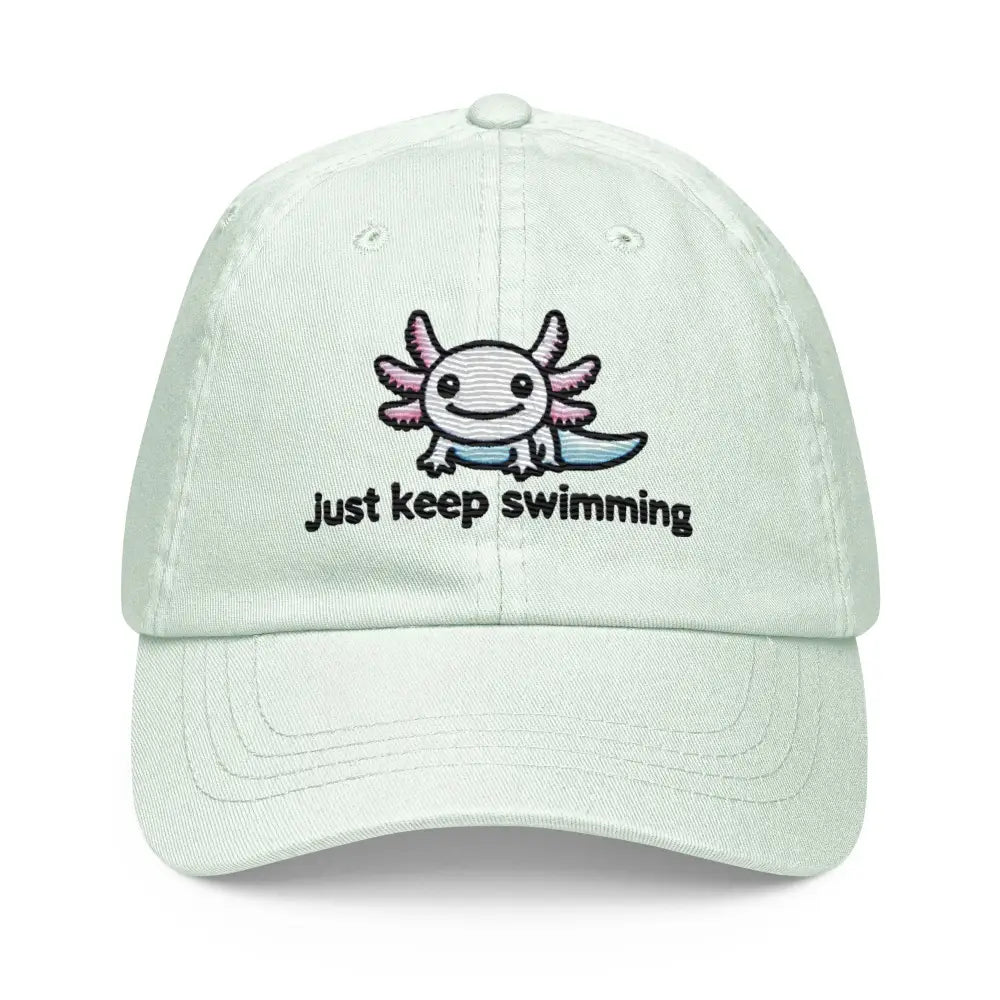 Light mint green pastel baseball hat with embroidered axolotl and Just keep swimming