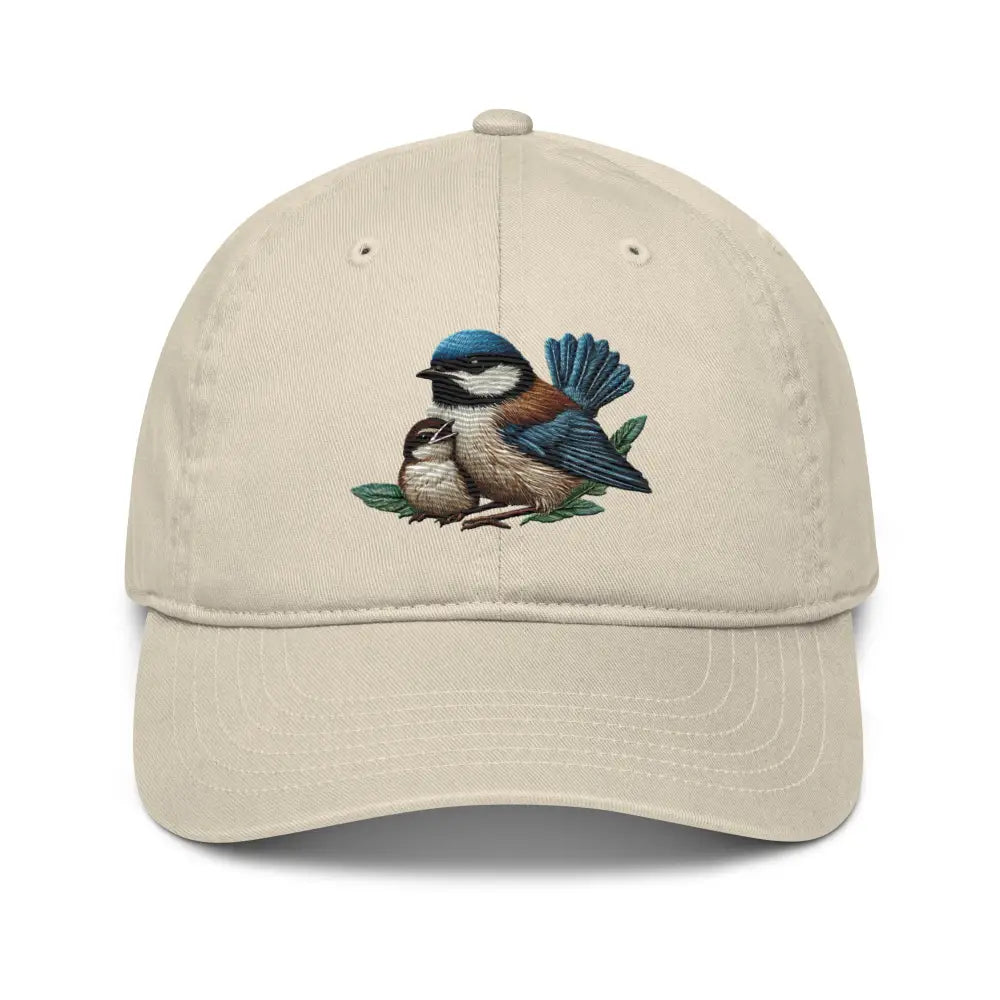 Light beige organic cotton dad hat with embroidered bird and baby design