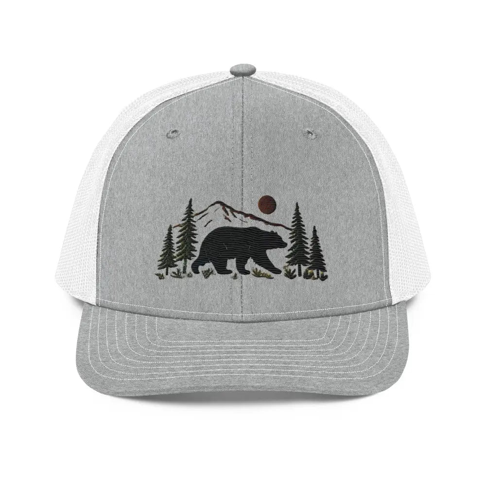 Embroidered black bear wildlife trucker cap with mountains