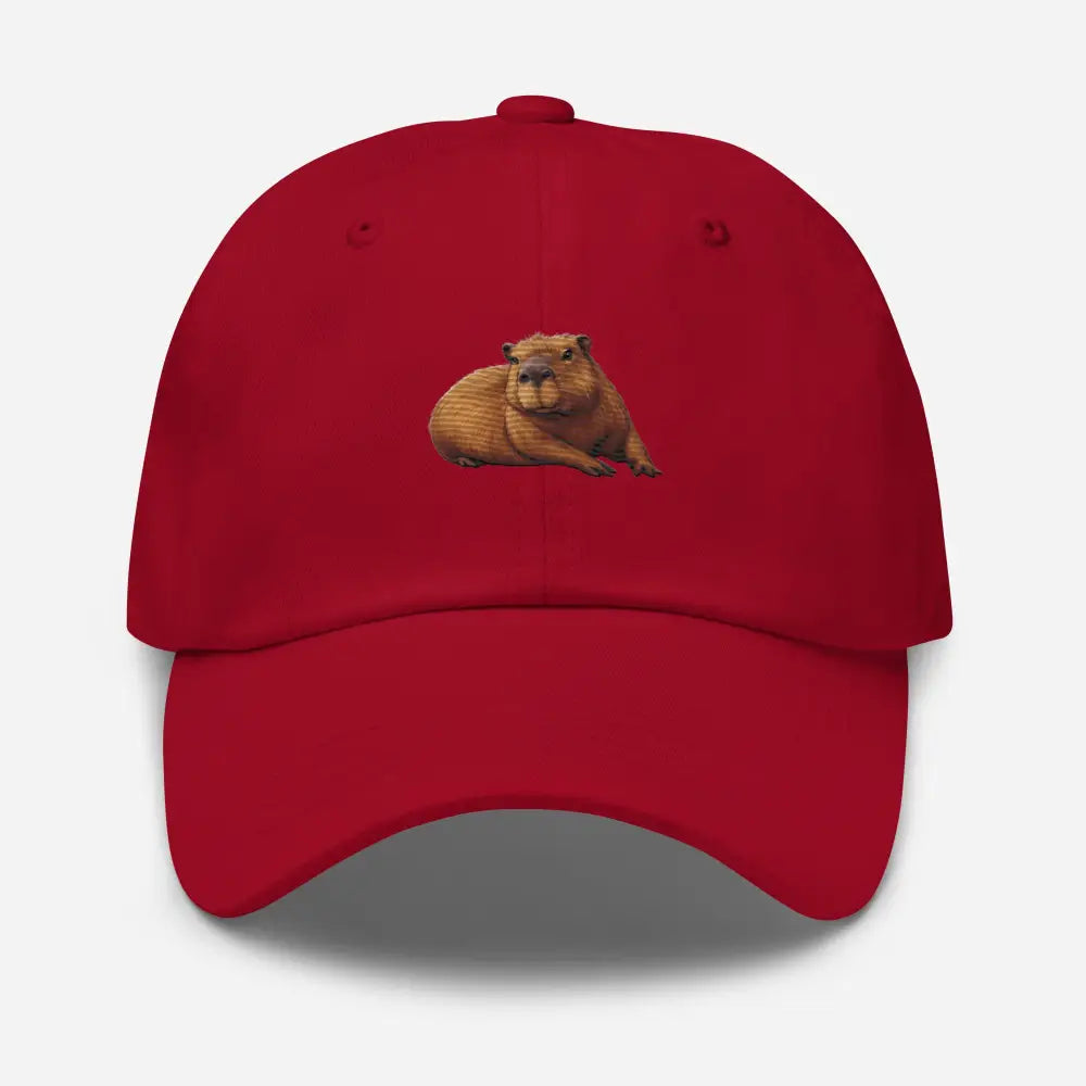 Red embroidered capybara dad hat by Trini Skies