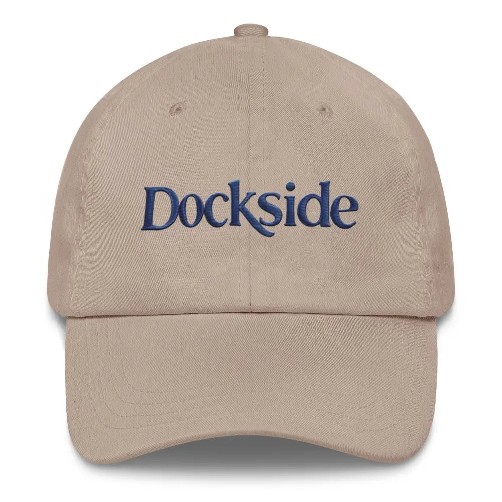 Beige embroidered dockside dad hat with blue text