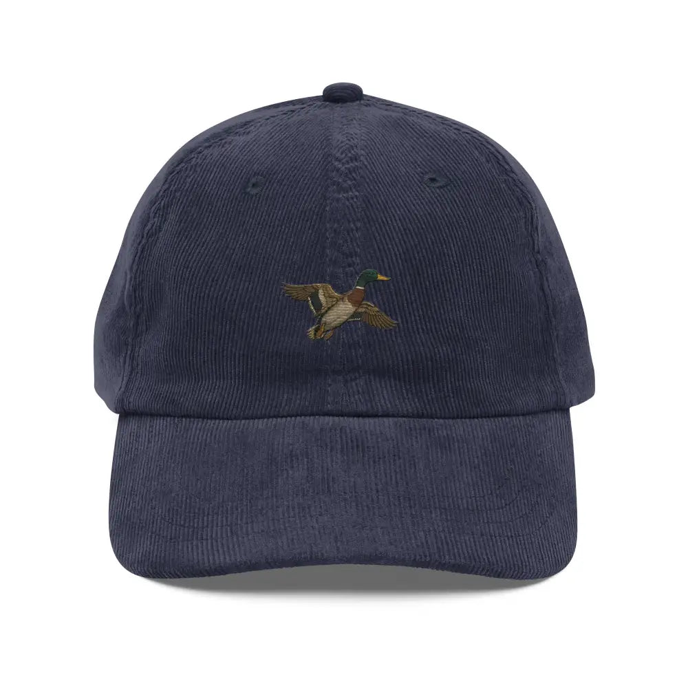 Embroidered flying duck on navy blue Trini Skies corduroy hat